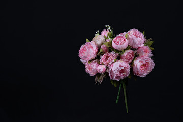 Beautiful bouquet of pink peonies . Floral composition on black background.