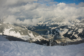 Ski slope, resort and outdoor activities in the winter in the Alps.