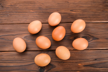 Fresh eggs on  wooden background