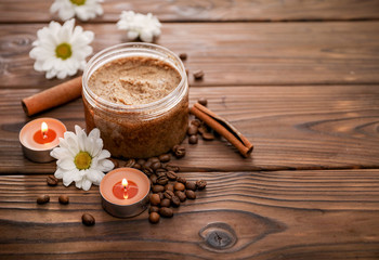Coffee scrub on brown wooden background