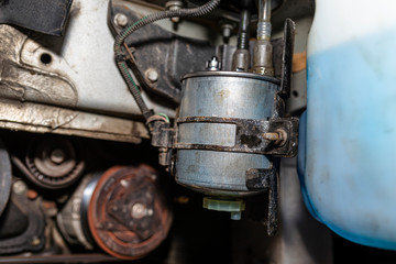 New fuel filter mounted and screwed on the car in the wheel arch.