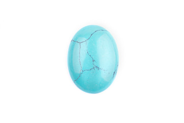 Oval cabochon stone in blue on a white isolated background