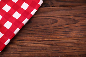 Fototapeta na wymiar Red napkin on wooden table
