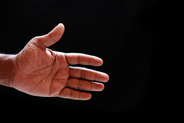 Cropped view of hands on black background.