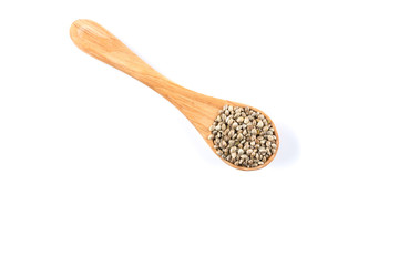 Cannabis Hemp seeds in spoon on white