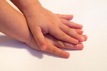 hands of a child on a white background