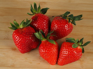 Fresh strawberries on a wooden background