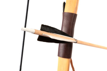 Bamboo bow for shooting and arrow, close-up, isolated on a white background