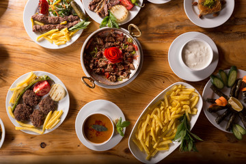 assorted turkish kebabs on wooden table
