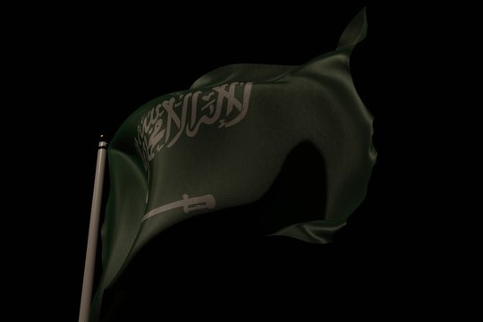 Flag of Saudi Arabia on pole waving in the wind, pitch black background and moody look. 3D rendering.