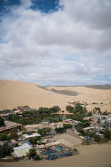 Huacachina - Ica an oasis in the middle of the ICA desertion with a lagoon and house for tourism