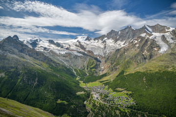 View on Saas-Fee village with beautiful Alps and Fee glacier in background in Switzerland