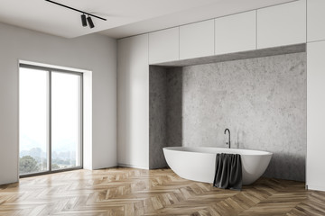 Bathtub in white loft bathroom corner