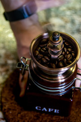 Beautiful manual coffee grinder grinds coffee beans