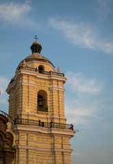 Bell tower of a church in the afternoon and sky with blue clouds