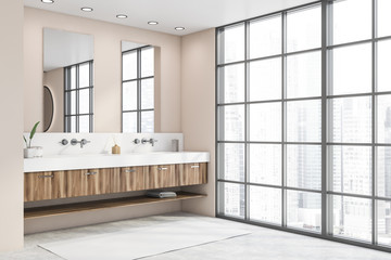 Double sink in panoramic beige bathroom corner