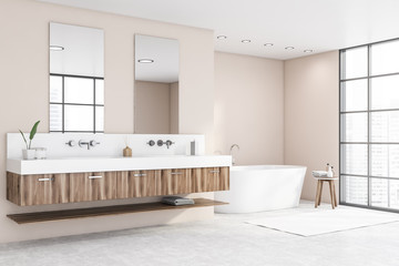 Panoramic beige bathroom corner, tub and sink
