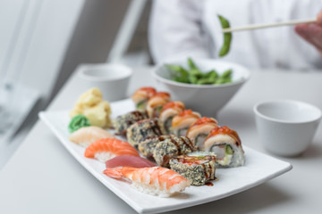 Sushi Roll Set with Seafood on White Plate. Lunch in Japanese Restaurant