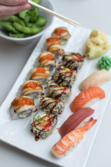 Sushi Roll Set with Seafood on White Plate. Lunch in Japanese Restaurant
