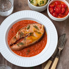 Wild Salmon Steak with Roasted Tomato Sauce Garnished with Dill and Lemon Zest