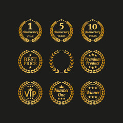 Set of golden laurel wreaths on black background.