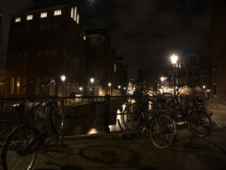 Views of the canal in Amsterdam Centrum with bikes parked