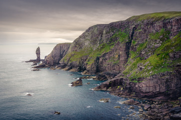 Fototapeta na wymiar Rock pinacle ponting out of the sea, Scotland