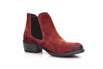 Female brown leather boot on white background, isolated product, top view.