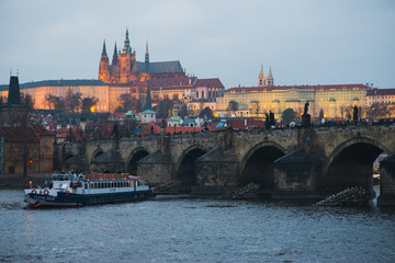 Naklejka na ściany i meble Evening walk sightseeing traveling fall to Prague, Czech Republic. Charles bridge and promenade.