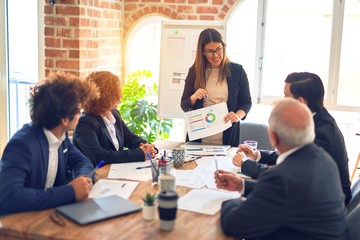 Group of business workers working together in a meeting. Listening one of them speaking at the office.