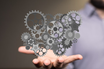 Business, Internet and technology concept. Business select gear icon on virtual screen.