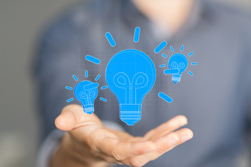idea lamp concept in hand.