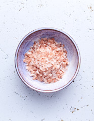 Pink Himalayan Salt in a ceramic bowl. Top view