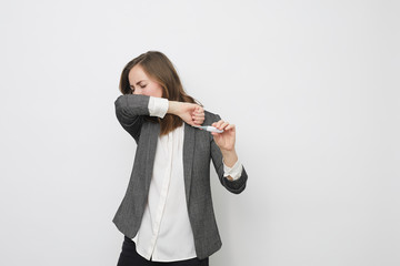 business woman sneezing and coughing over a cold or flu as corona virus covid-19 ilness and disease