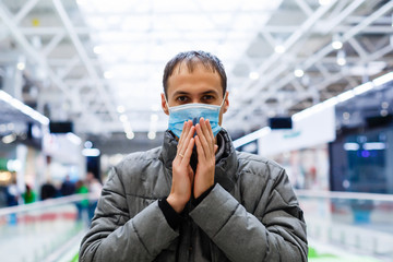 Man wearing mask for protect Novel Coronavirus:2019 or PM 2.5 dust and serious of the air pollution in department store.