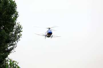 Agricultural helicopters fly in the sky