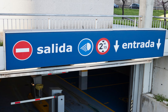Salida, entrada sign at underground parking entrance. Exit, entry in spanish.