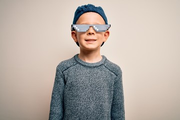 Young little caucasian kid wearing internet meme thug life glasses over isolated background with a happy and cool smile on face. Lucky person.