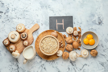 Healthy products rich in vitamin H on grey background