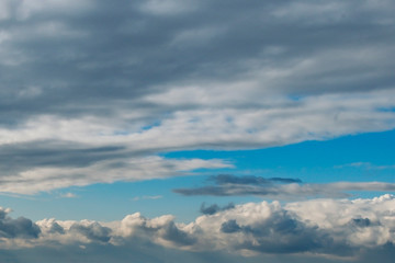 Fototapeta na wymiar White clouds in a clear sky
