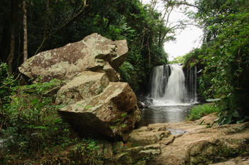 Beautiful waterfall of the pirahy river, view between rocks and native forest