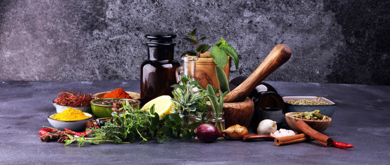 Spices and herbs on table. Food and cuisine ingredients with pepper © beats_