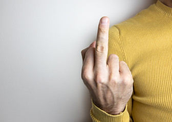 Hand making a very rude gesture concept