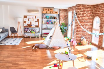 Picture of preschool playroom with colorful furniture and toys around empty kindergarten © Krakenimages.com