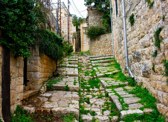 Fototapeta na wymiar Narrow cobble stone path in the medieval Lebanon mountain town of Deir El Qamar