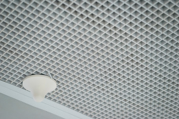 Lighting and ceiling finishes in of the modern ceilings and interior in the office. Lighting...