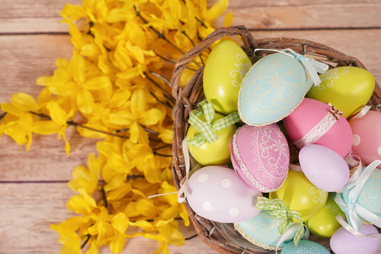 Easter eggs and spring flower on the wood table. background image