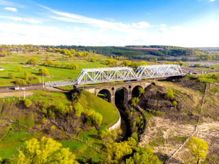 Metal bridge over the river landscape