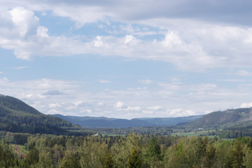 Fototapeta na wymiar A view of the hills from the lookout point at Döda Fallet in Sweden