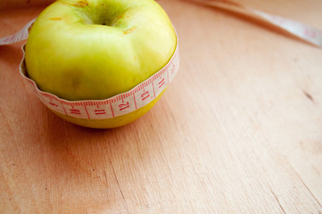 apple and measuring tape